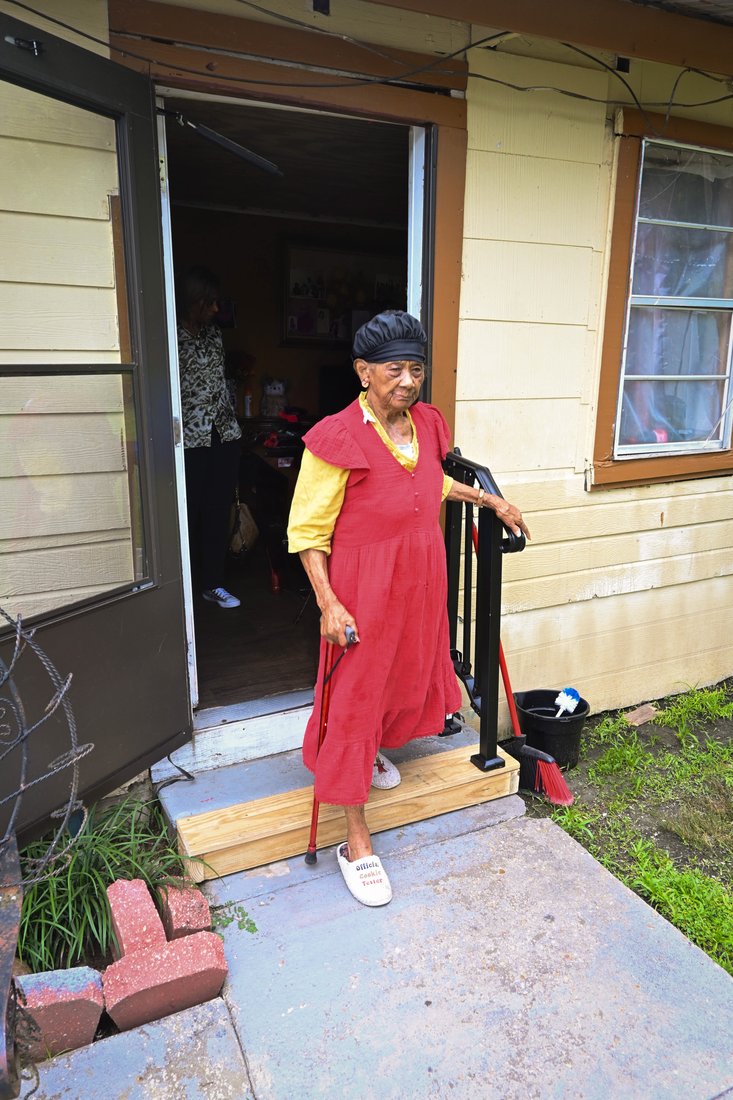 Lillian Perry standing in the doorway of her home in Maringouin, Louisiana