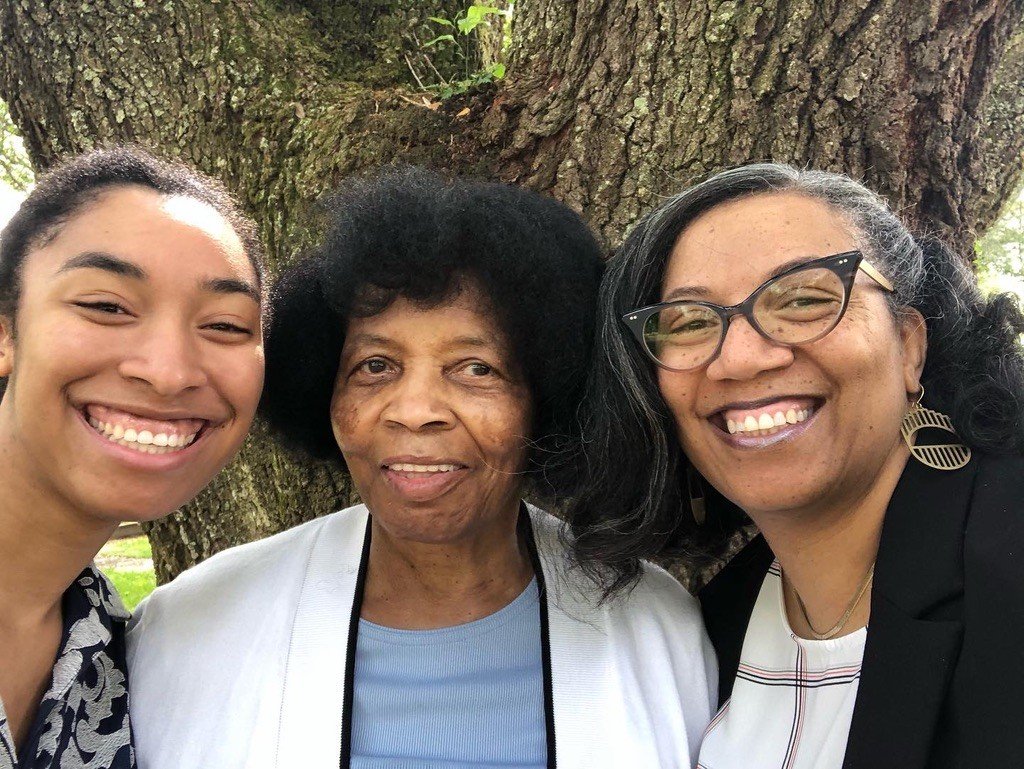 Monique Trusclair Maddox with her daughter and mother in front of a live oak
