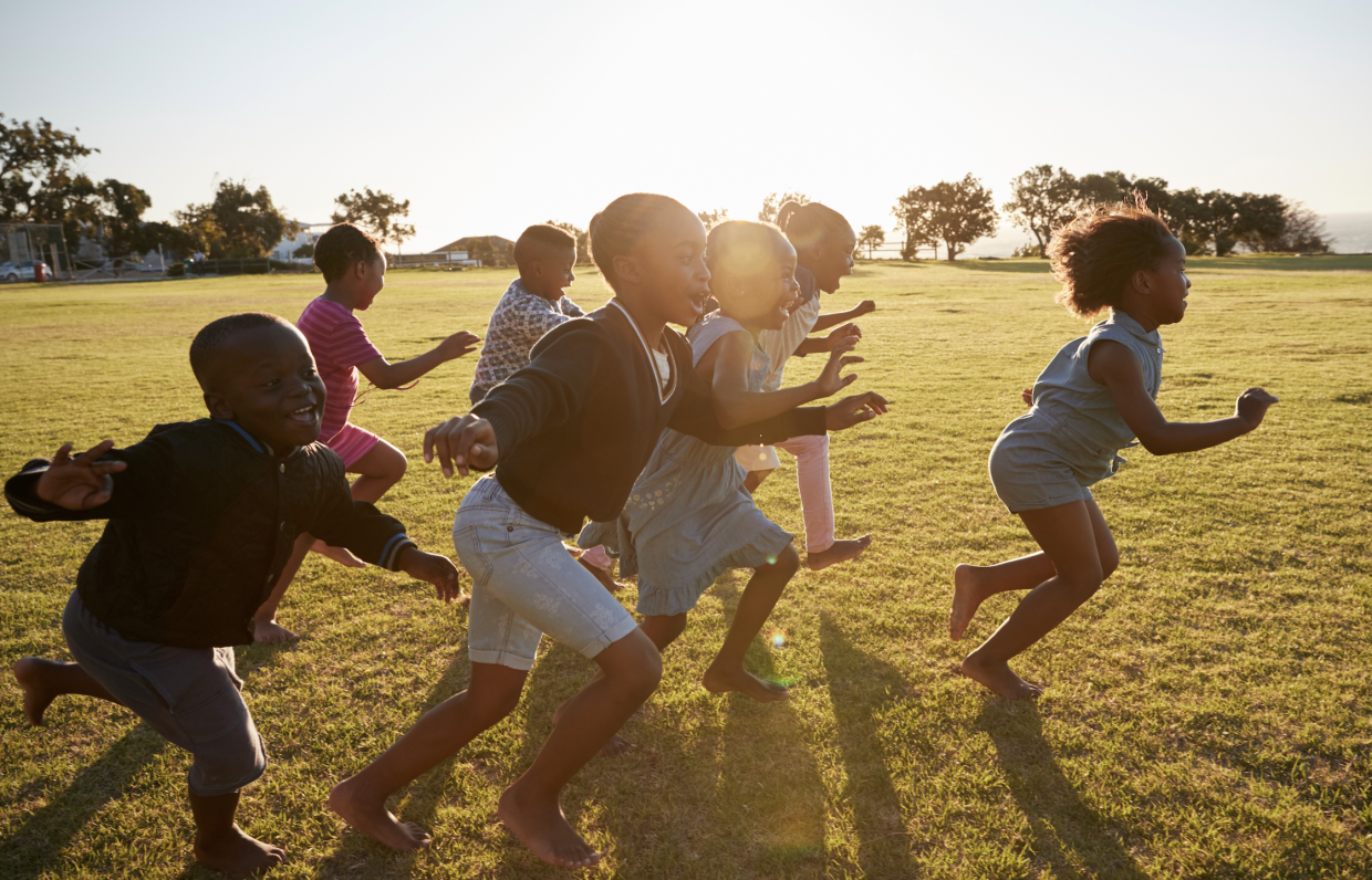 Joyful children running in a field