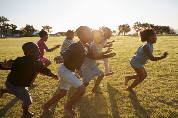 Joyful children running in a field